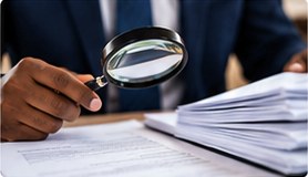 Audit and assurance professionals reviewing financial statements